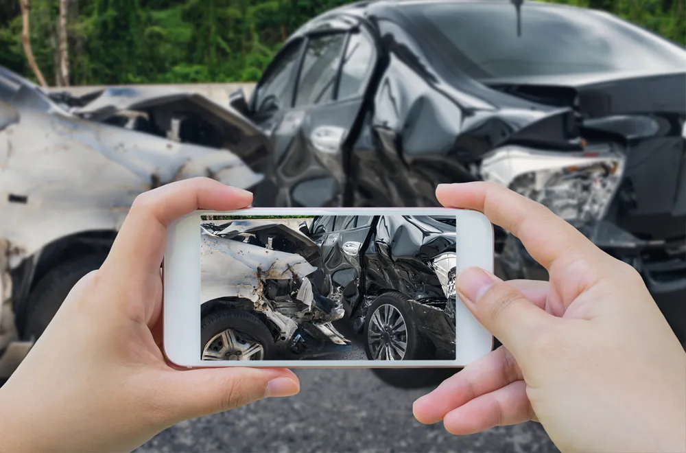 Take photographs of damage and crash scene