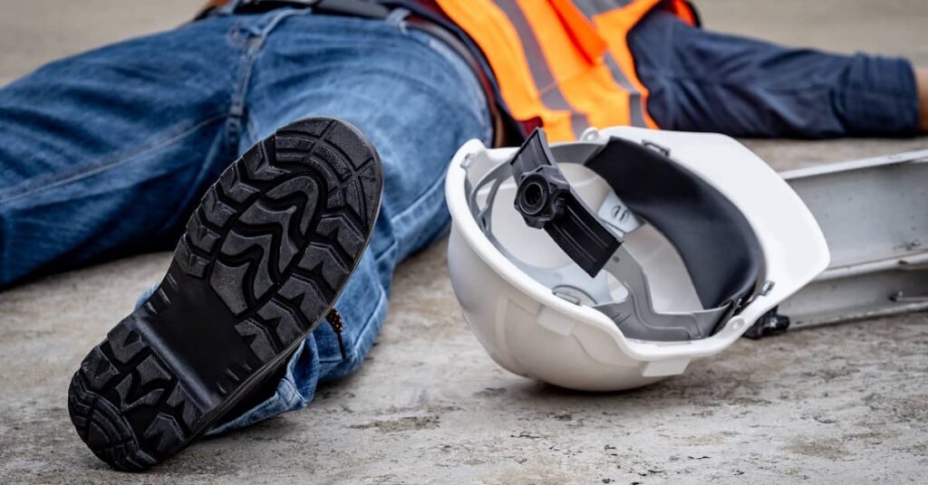 Injured worker lying on the floor after an accident at work | Arnold Dallas McPherson Injury Lawyers